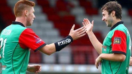 Kym Nelson and Fra McCaffrey celebrate Glentoran's early goal against Coleraine