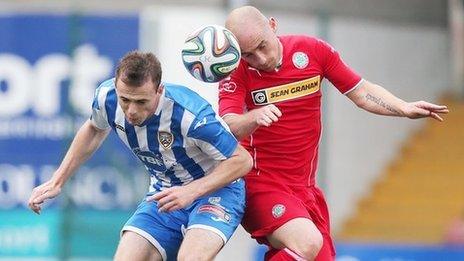 Darren McCauley and Barry Johnston in aerial action