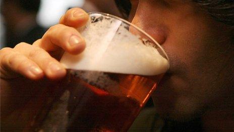 Man drinking pint of beer