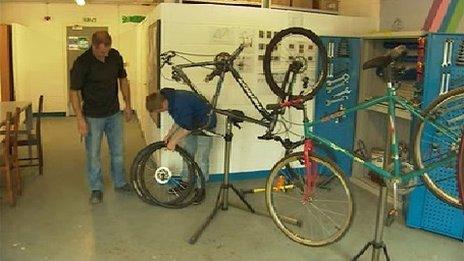 Jock fixes a tyre for a bicycle