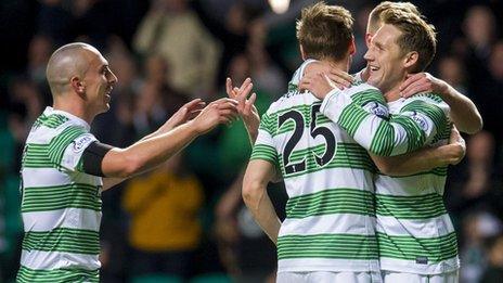 Celtic's Kris Commons (right) is mobbed by team-mates as they celebrate his penalty goal