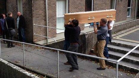 Campaigners carry coffin with objection letters