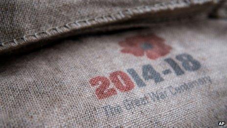 A sandbag marked with a poppy emblem bearing the words: "2014-18: The Great War centenary."