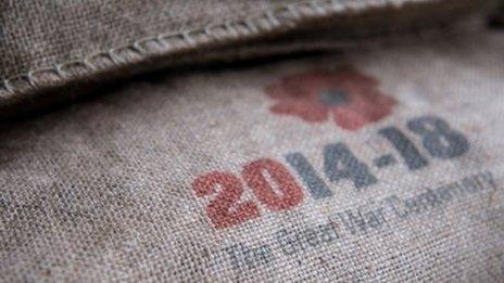 A sandbag marked with a poppy emblem bearing the words: "2014-18: The Great War centenary."