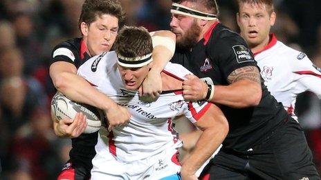 Robbie Diack is tackled by Sam Beard and Rory Sutherland