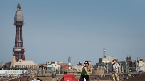 People on the beach with Blackpool Tower in the background