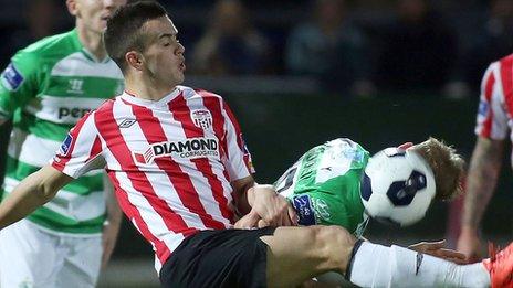 Derry City's Michael Duffy in action against Conor Kenna of Shamrock Rovers