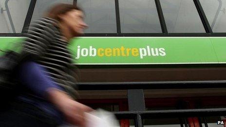 Woman walking past Job Centre