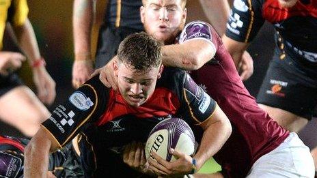 Elliott Dee is tackled by Rory Clegg
