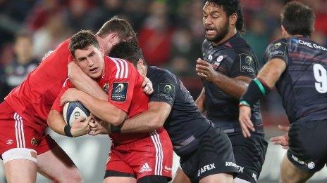 Munster's Ian Keatley is tackled