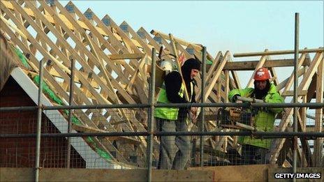 Builders working on a roof