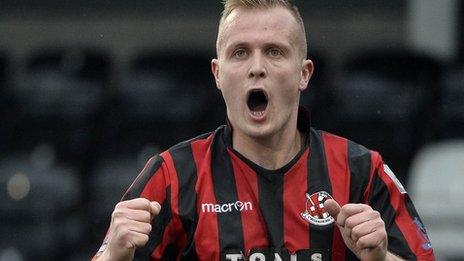 Jordan Owens celebrates scoring against Warrenpoint