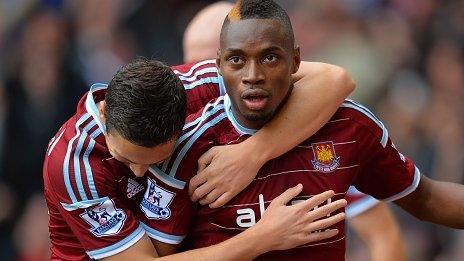 Diafra Sakho is congratulated by West Ham team-mate Stewart Downing