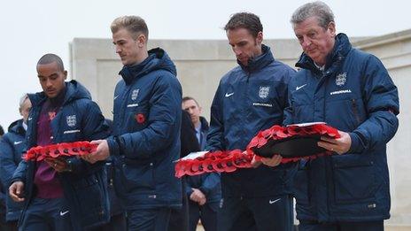 Theo Walcott (left), Joe Hart, Gareth Southgate and Roy Hodgson lay wreaths on Remembrance Day