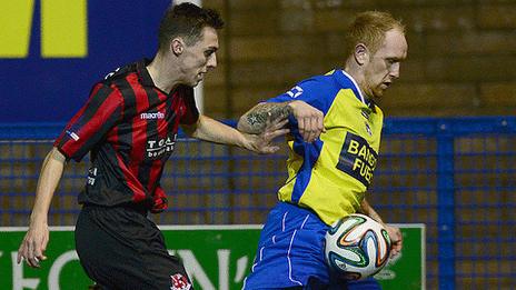 Action from the League Cup match between Bangor and Crusaders