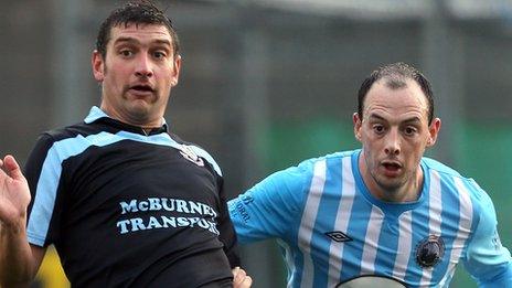 Matt Tipton of Ballymena United in action against Warrenpoint Town's Johnny Cowan