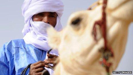 A Tuareg man on his camel during the annual festival of Assihar in Tamanrasset, Algeria