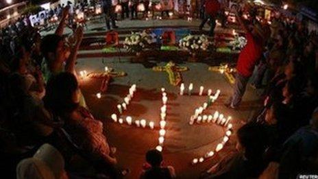 Candles arranged in honour of the 43 missing students