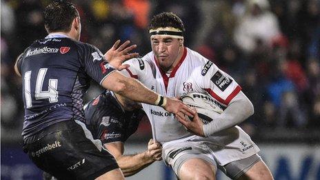 Ospreys wing Tom Grabham challenges Ulster's Rob Herring