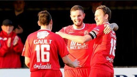 Portadown players congratulate Darren Murray after he opens the scoring at Stangmore Park