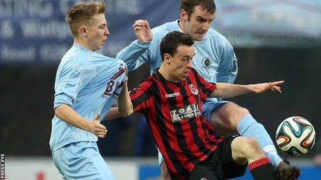 Institute pair Matty Young and Aaron Walsh close in on Crusaders winger Paul Heatley