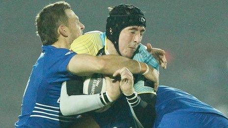 Sam Davies of Ospreys is tackled by Jimmy Gopperth and Jordi Murphy of Leinster