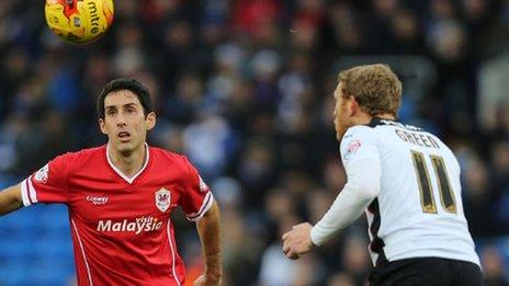 Cardiff City's Peter Whittingham looks to win the ball from Rotherham's Paul Green