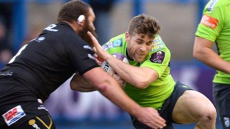 Gavin Evans of Cardiff Blues is tackled by Geoff Cross of London Irish
