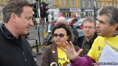 David Cameron in Chipping Norton being confronted by ACE Centre protesters