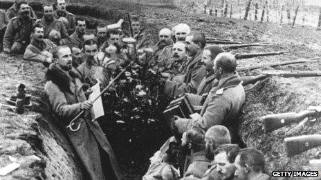 German soldiers cluster round a Christmas tree in 1914