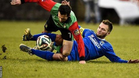 Glentoran winger David Scullion is tackled by Dungannon's Ryan Harpur