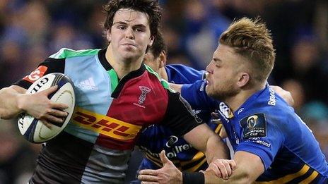 Tim Swiel of Harlequins is tackled by Leinster's Ian Madigan