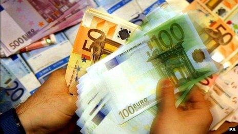 Man counting euro notes