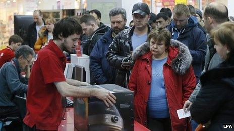 Russians paying for goods