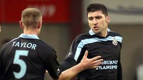 Ballymena players congratulate Davy Munster after he scored the opening goal