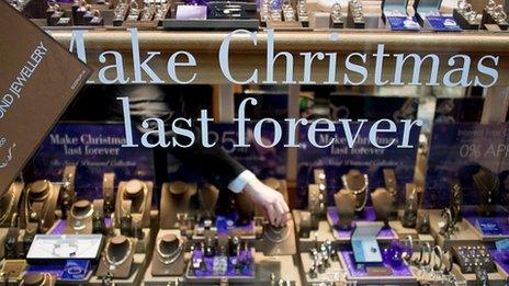 "make Christmas last forever" sign in shop window