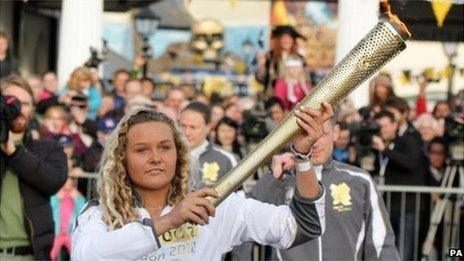 Tassie Swallow holding the Olympic torch