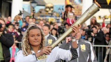 Tassie Swallow holding the Olympic torch