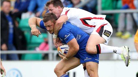 Leinster's Jimmy Gopperth has to take the weight of Ulster wing Craig Gilroy