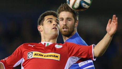 David McDaid of Cliftonville in action against Ballinamallard's Mark Stafford