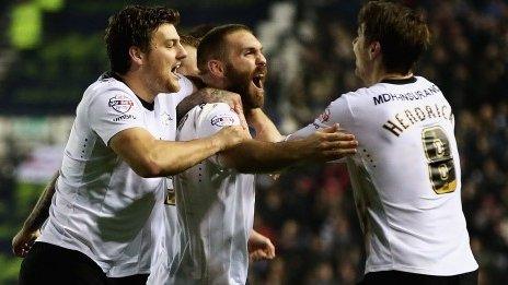 Derby players celebrate