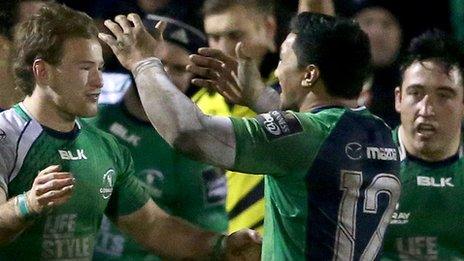 Connacht's Kieran Marmion and Bundee Aki celebrate Aly Muldowney's try against Munster