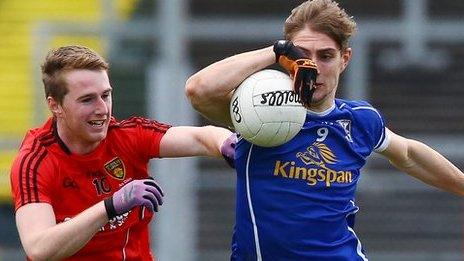 Paul Devine and Killian Clarke contend for possession as Cavan beat Down at Pairc Esler