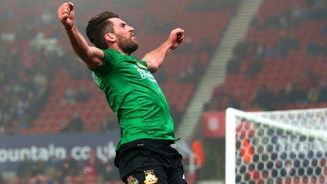 Mark Carrington celebrates after putting Wrexham ahead at Stoke