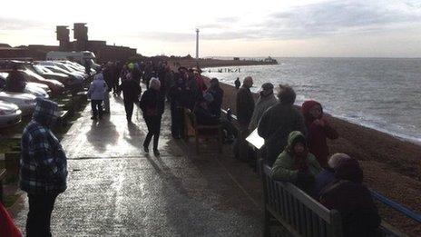 Spectators gathered to watch the ship arrive