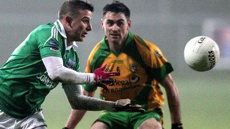 Fermanagh forward Shane McCabe is challenged by Donegal's Shane McGowan