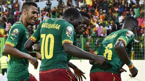 Cameroon players celebrate their goal