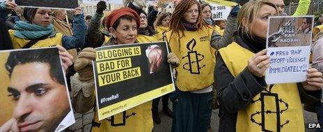 People take part in an Amnesty protest in front of the Saudi embassy in Vienna - 16 January 2015