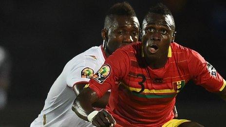 Guinea defender Issiaga Sylla vies with Mali's forward Modibo Maiga