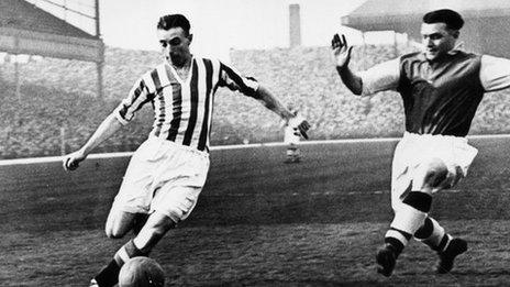 Sir Stanley Matthews beating a defender